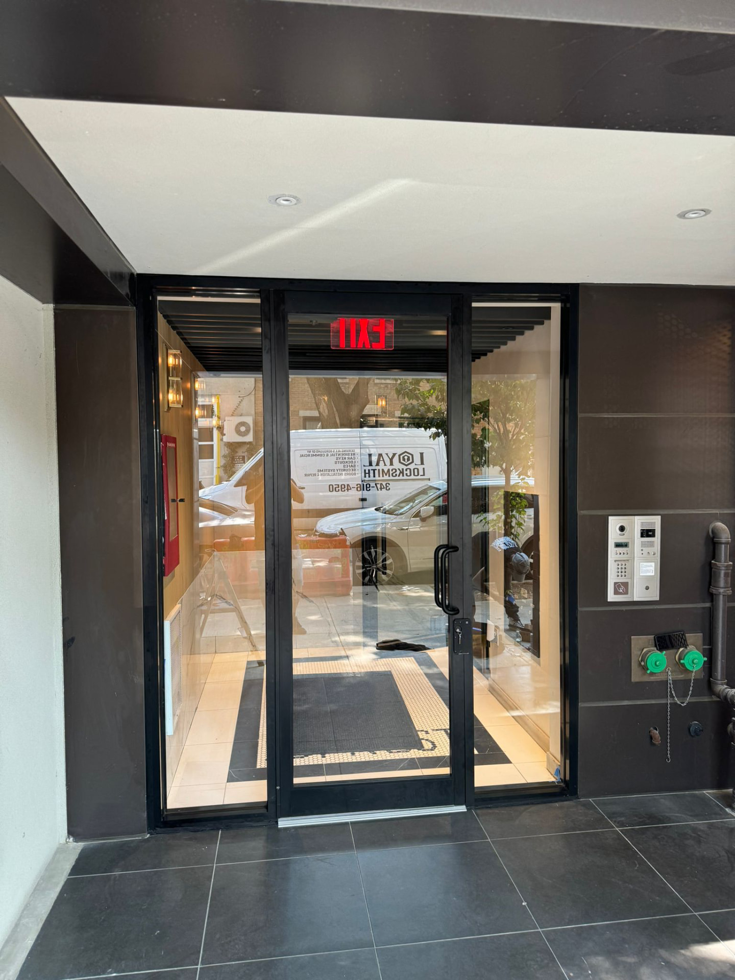 Commercial glass storefront door with access control hardware